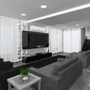 Ampla sala, com projeto moderno baseado nas cores preto, branco e suas tonalidades.